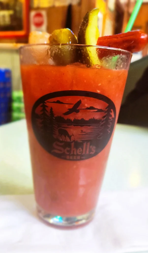 Bloody Mary at Mauer Brothers Tavern and Grill in Elba Minnesota topped with pickles and garnish. best Bloody Mary in Elba MN