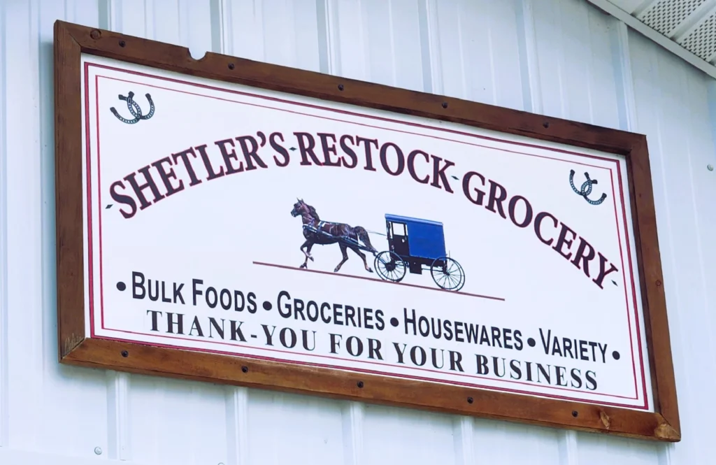 Shetler's Restock Grocery sign with horse and buggy near St. Charles MN Amish community