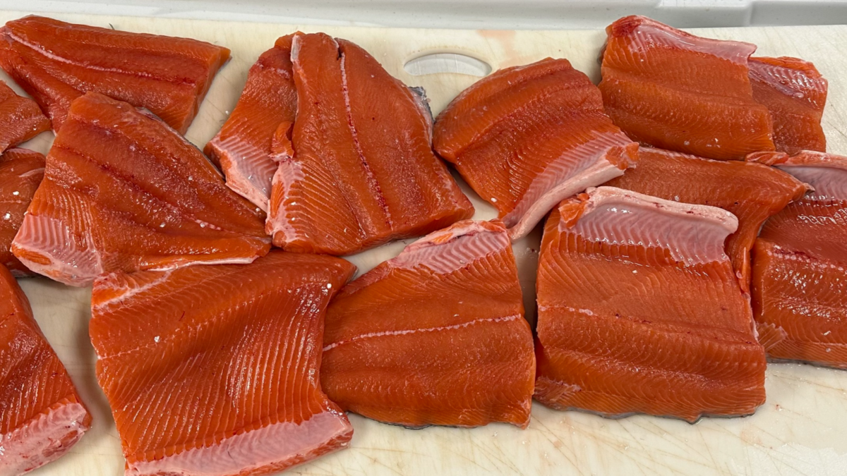 Freshly processed salmon fillets from King of the River in Alaska, ready for packaging.