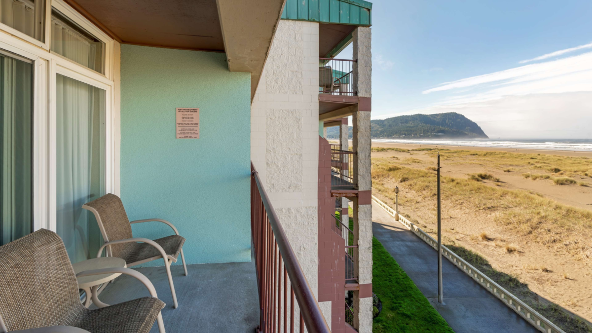 Oceanfront balcony at Best Western Plus Ocean View Resort in Seaside Oregon overlooking the beach and coastal trail