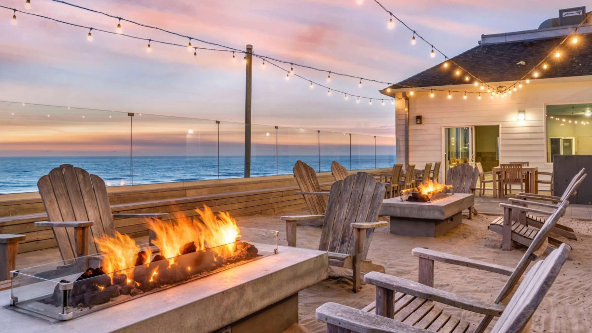 Outdoor fire pits and oceanview seating area at Elizabeth Oceanfront Suites in Newport Oregon during sunset