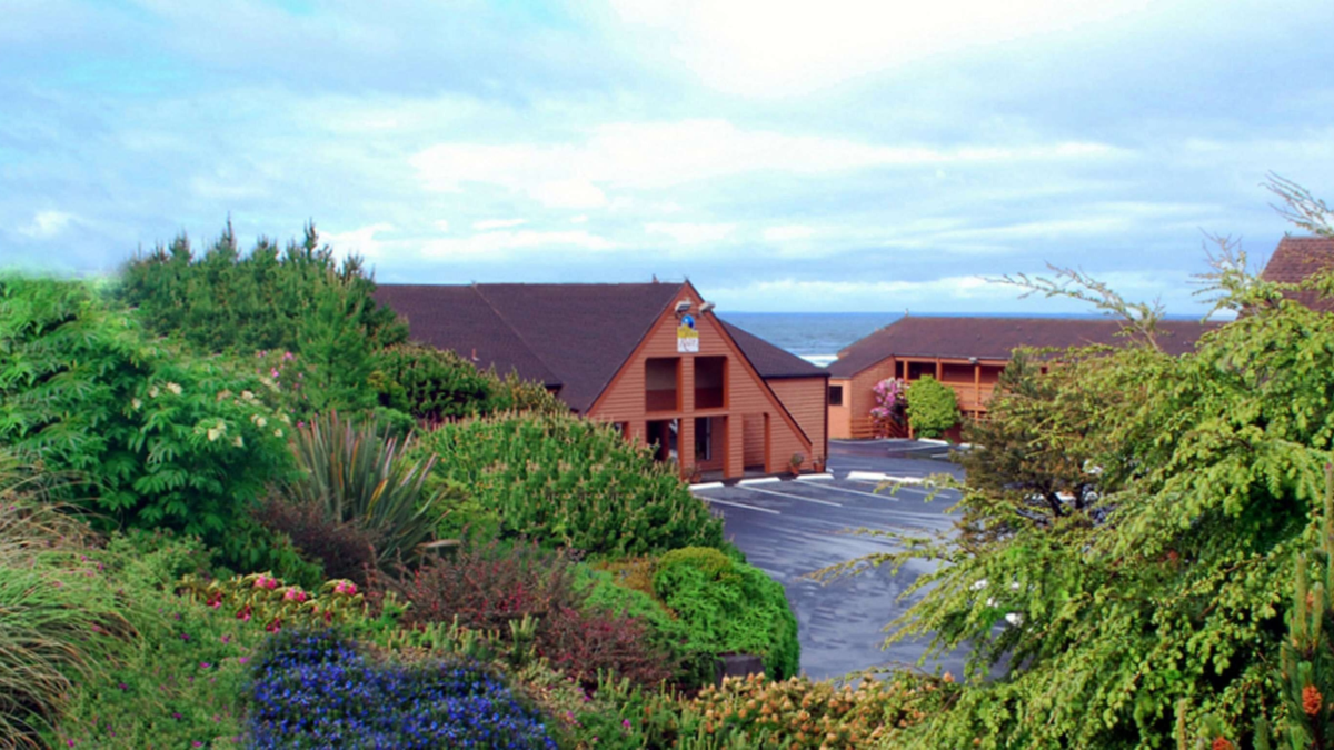 SureStay Plus Hotel by Best Western in Gold Beach Oregon surrounded by lush coastal gardens with ocean views