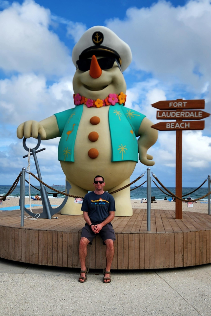 Fort Lauderdale Beach snowman statue and boardwalk sign