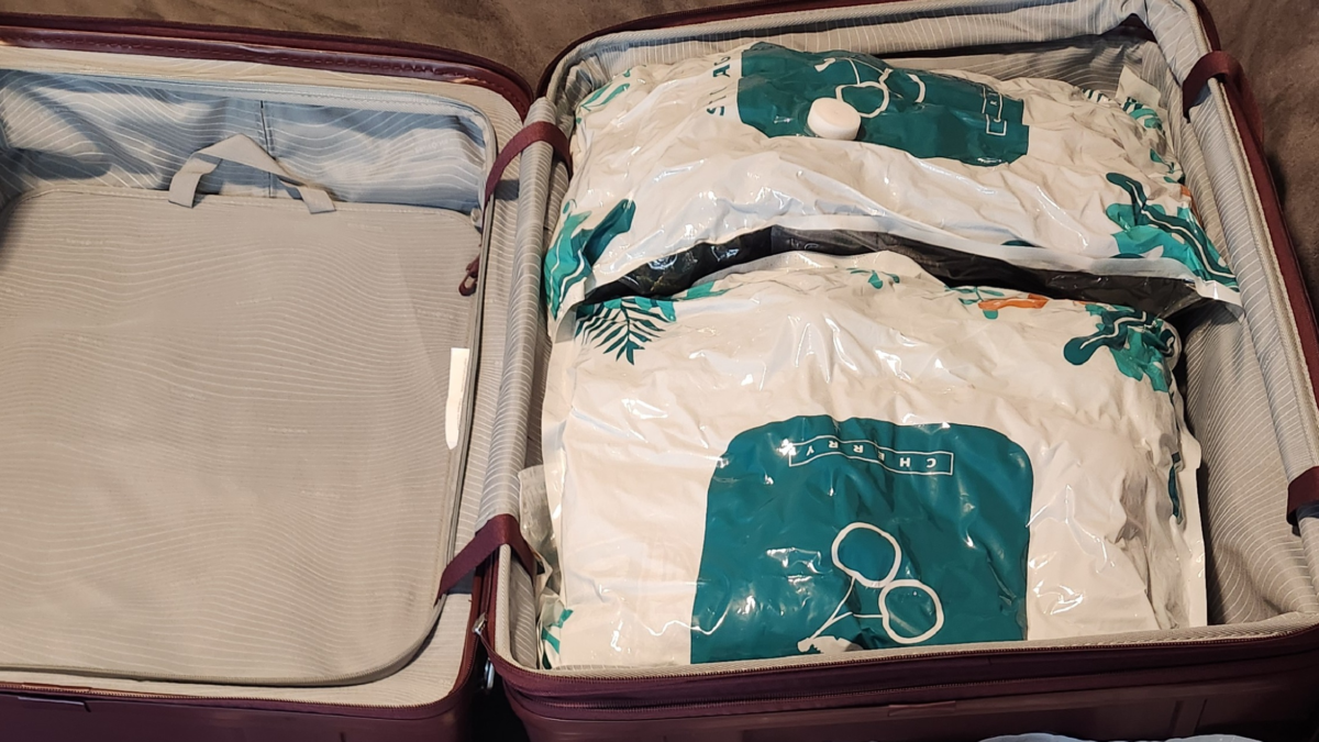 Vacuum bags in suitcase saving space for cruise packing list and efficient luggage organization