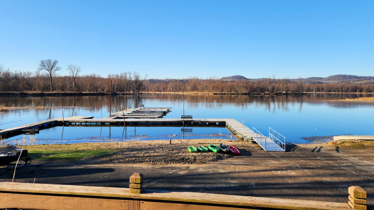 Deck view overlooking Mississippi River dock and kayaks Eagle Roost Resort