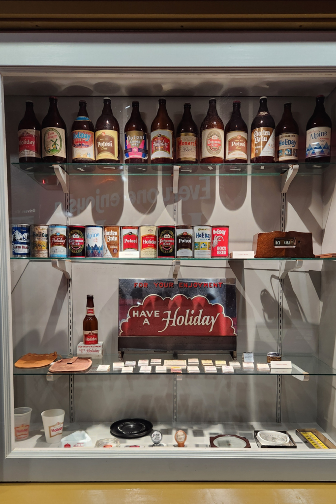 Large wall of vintage beer cans inside Potosi Brewing Company museum