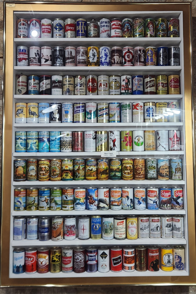 Vintage beer can collection displayed at Potosi Brewery museum in Wisconsin