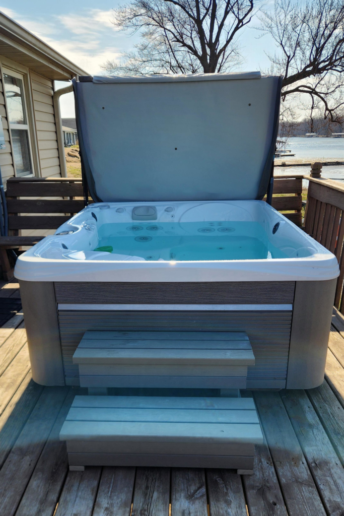 Private hot tub on cabin deck Eagle Roost Resort Mississippi River view. Mississippi River cabin with hot tub Wisconsin