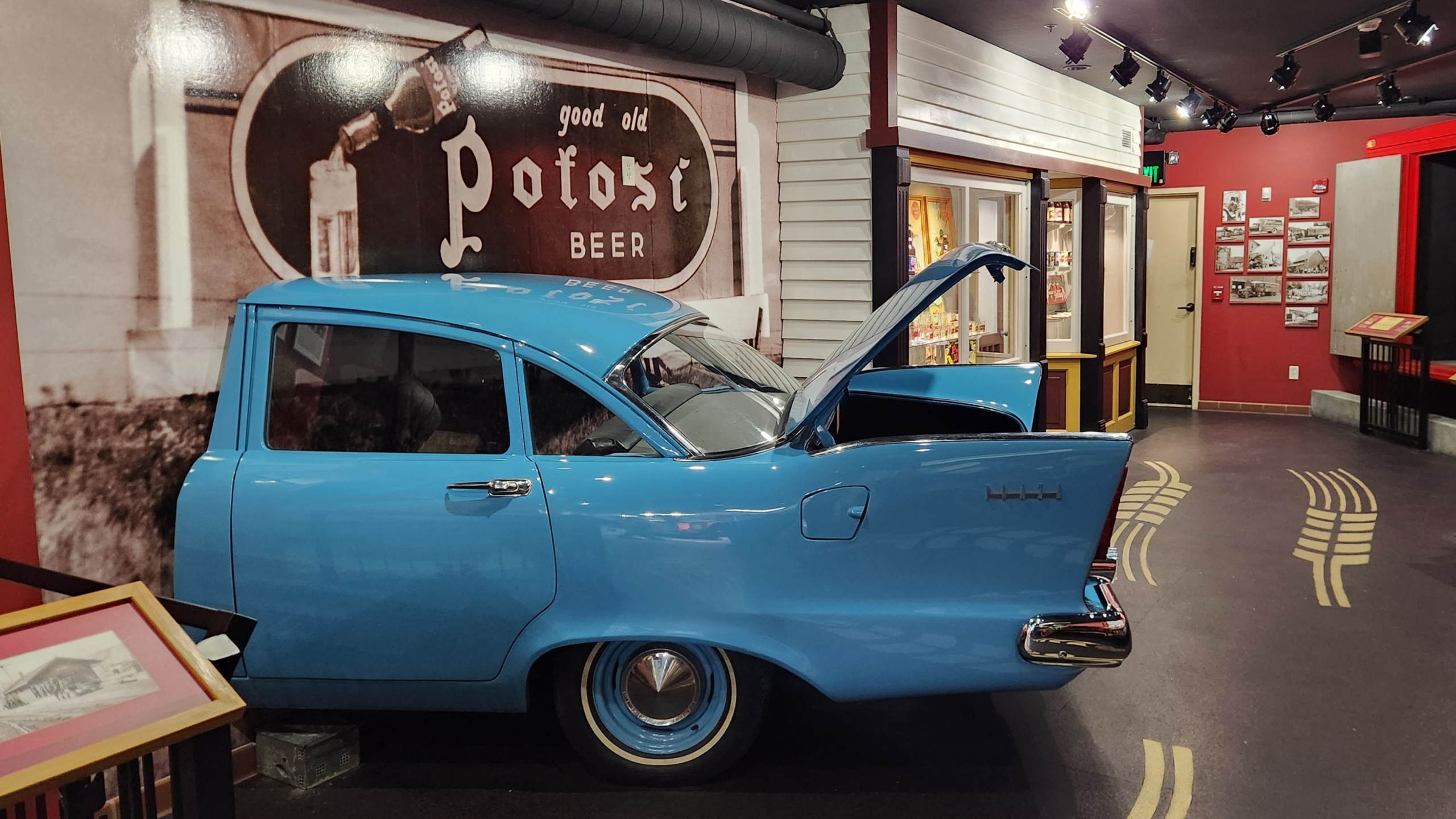 Vintage blue car display inside Potosi Brewery transportation museum Wisconsin