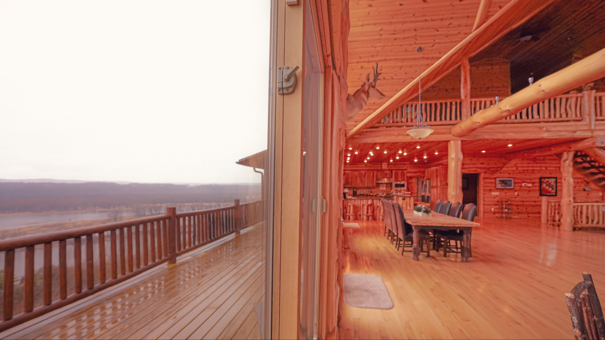 log cabin interior with river view deck near Cassville WI cabin rental. Cassville Wisconsin cabin rentals. Mississippi River vacation rentals Wisconsin
