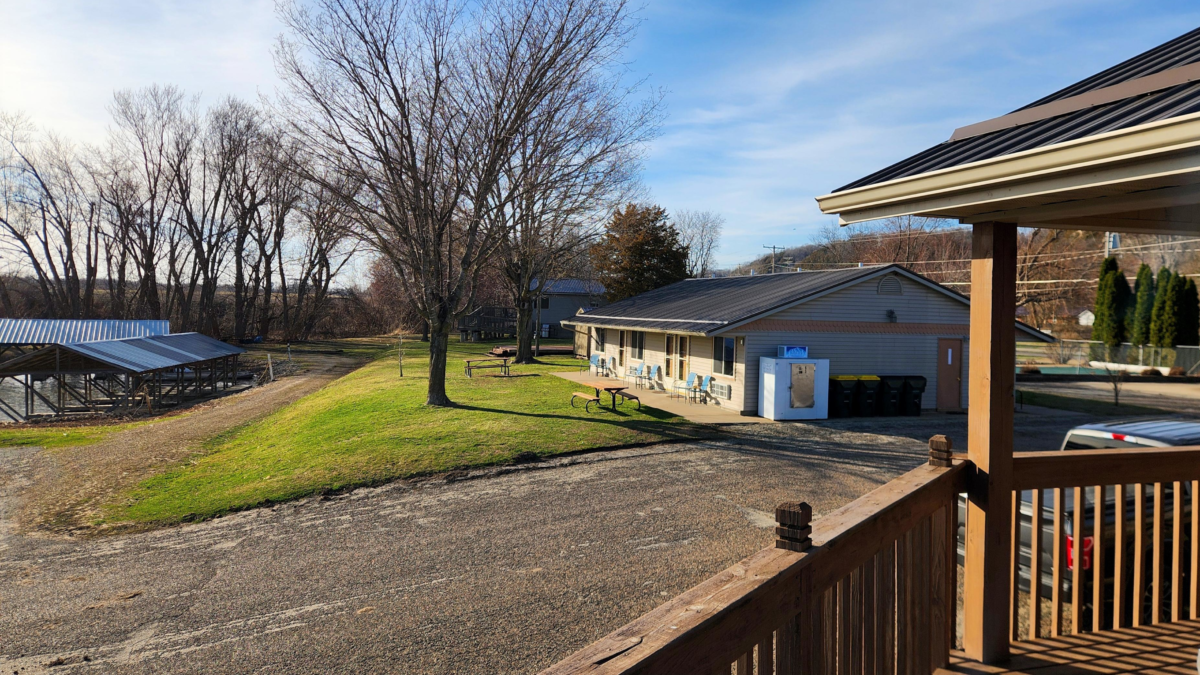 View from porch cabin at Eagle Roost Resort overlooking marina and motel