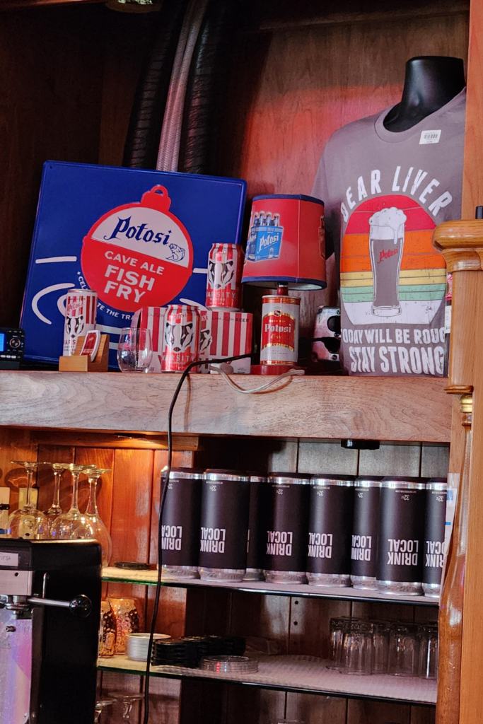 Potosi Brewery merchandise display with shirts and beer memorabilia