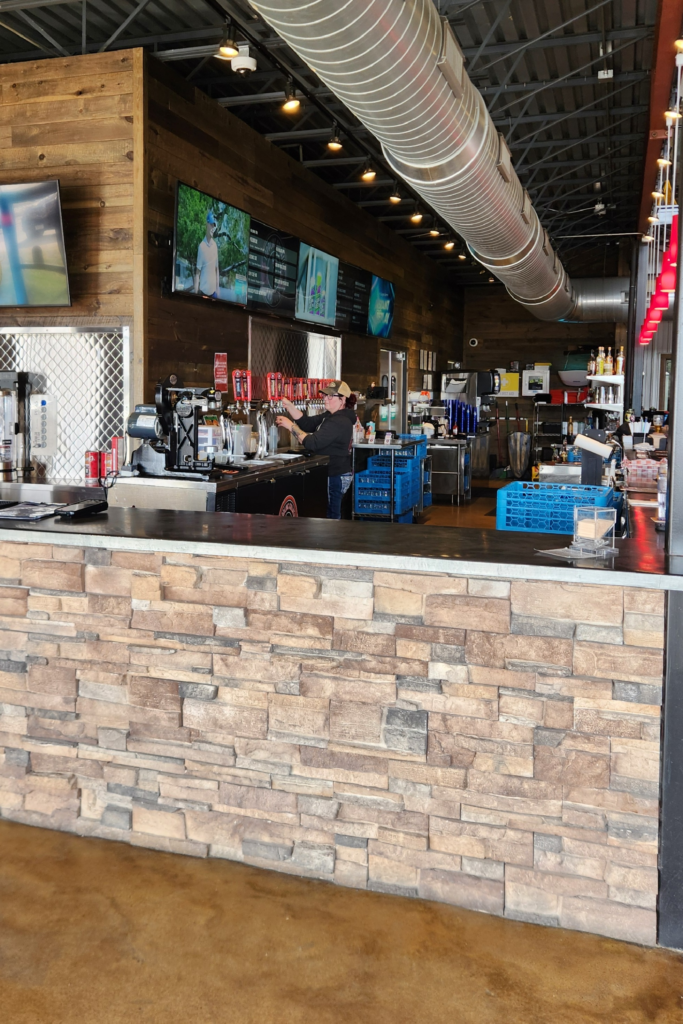 Bar and beer taps inside Toppling Goliath Brewing taproom in Decorah Iowa