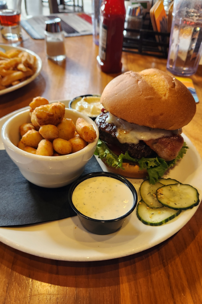 Cheeseburger with bacon and cheese curds served at Toppling Goliath Brewing Co