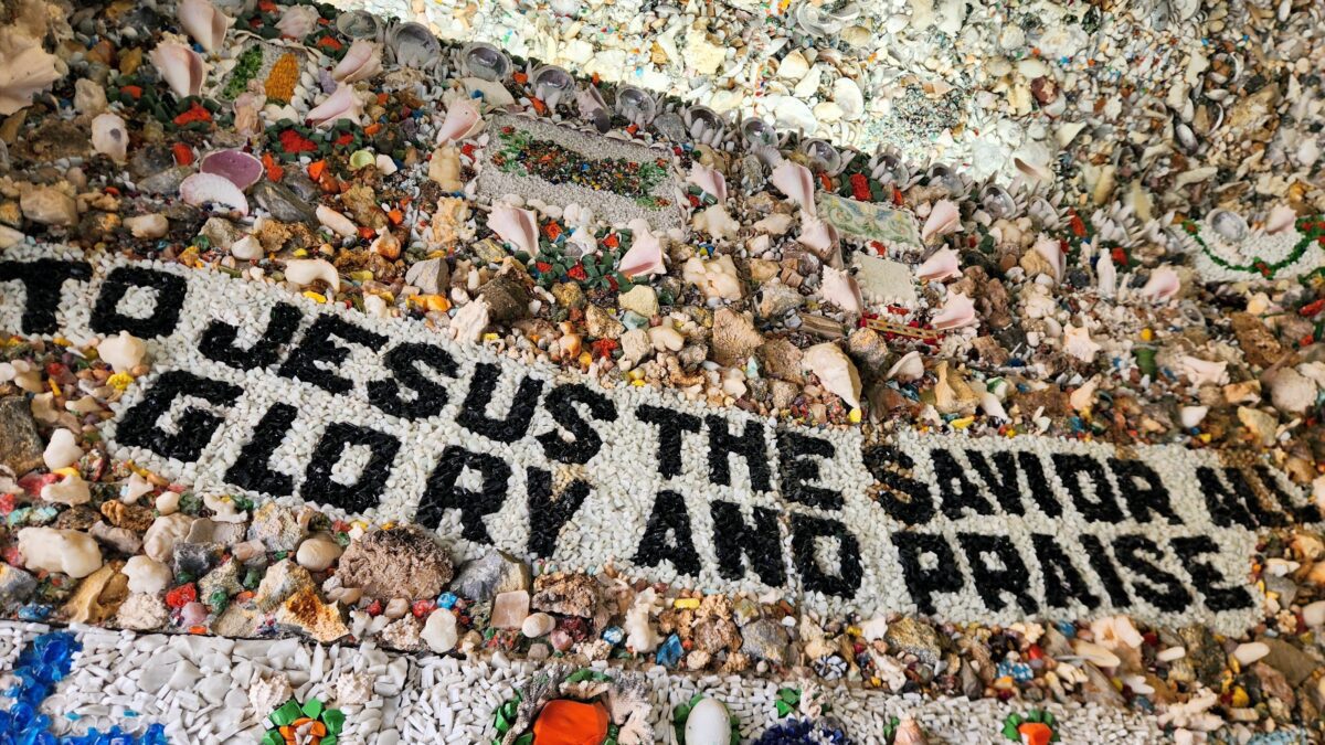 Shell mosaic banner reading Jesus the Savior at Dickeyville Grotto shrine