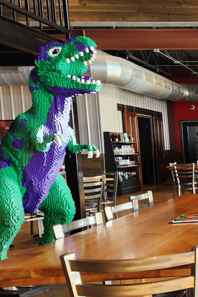 Close-up of giant LEGO dinosaur inside Toppling Goliath Brewing taproom