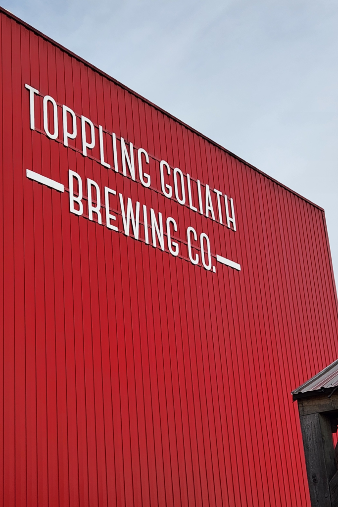 Toppling Goliath Brewing Co red exterior building sign in Decorah Iowa