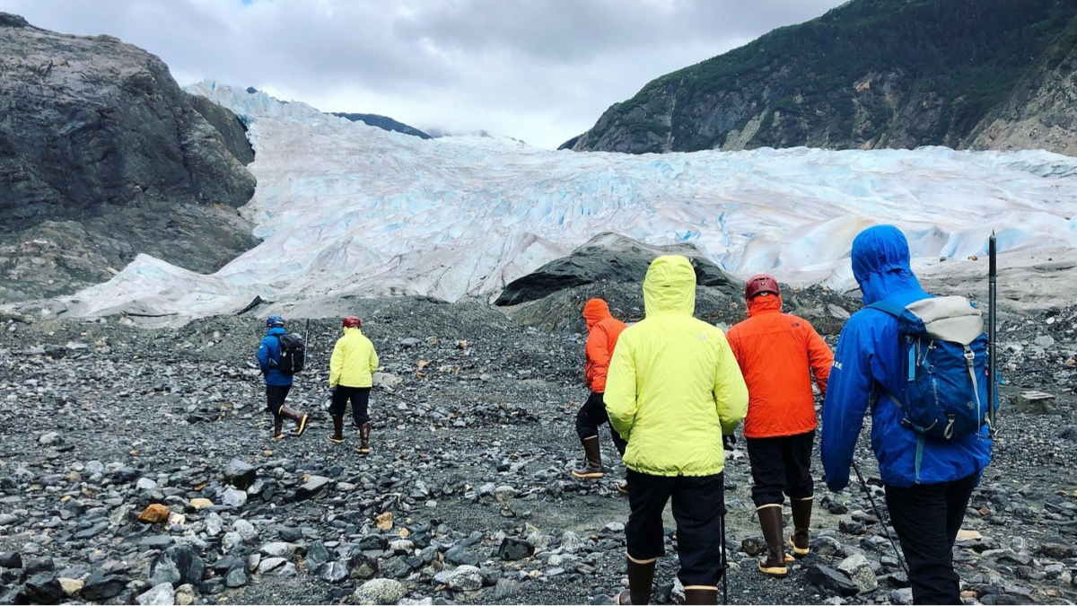 Hikers approaching Mendenhall Glacier on the Ice Adventure Tour in Juneau Alaska