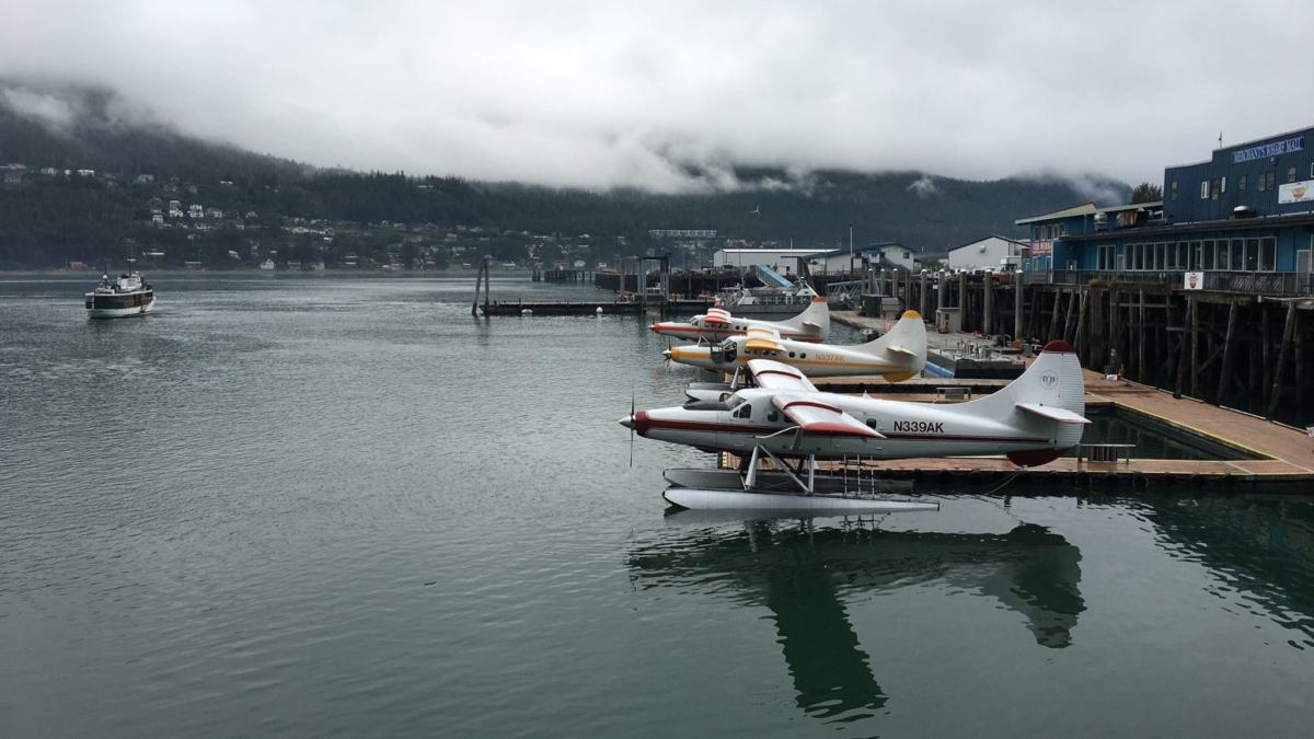 Seaplanes docked at the Juneau waterfront for flightseeing tours