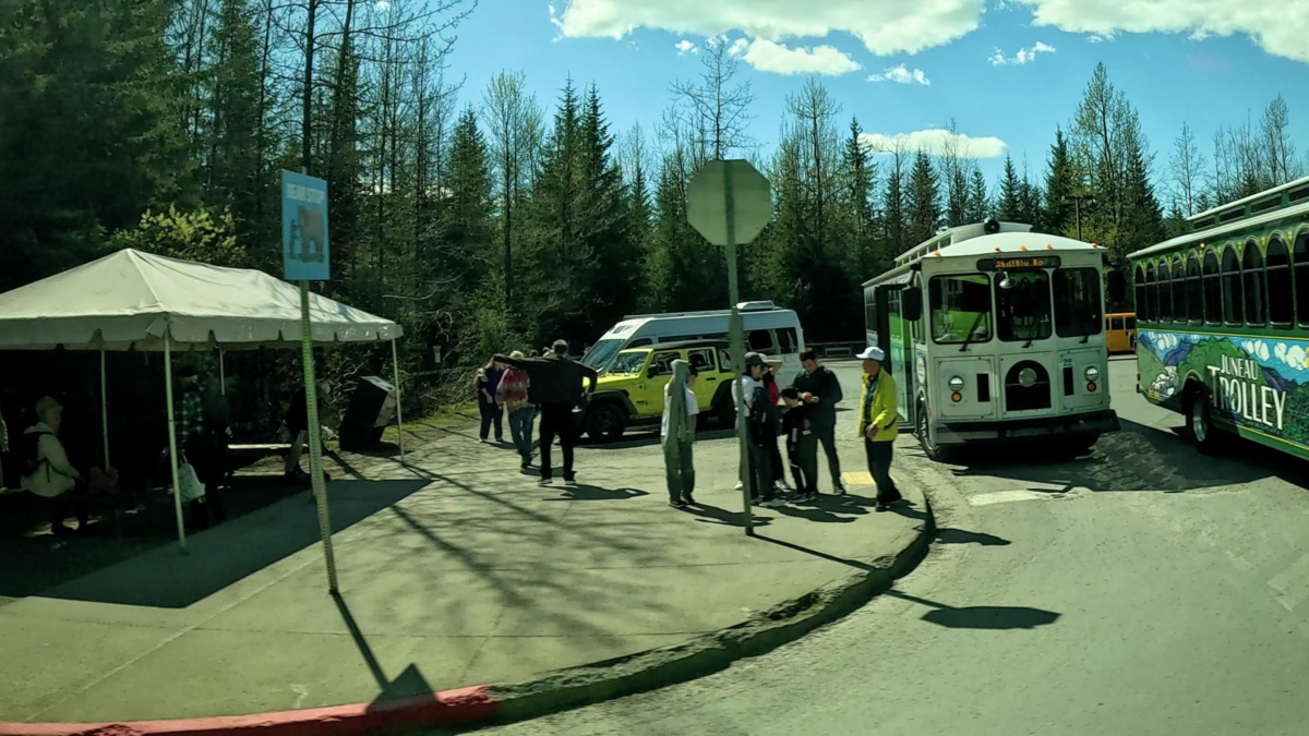 Visitors boarding transportation at Mendenhall Glacier in Juneau Alaska