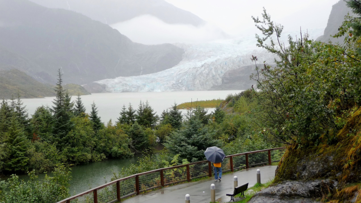 Visitor walking toward Mendenhall Glacier viewpoint in Juneau Alaska