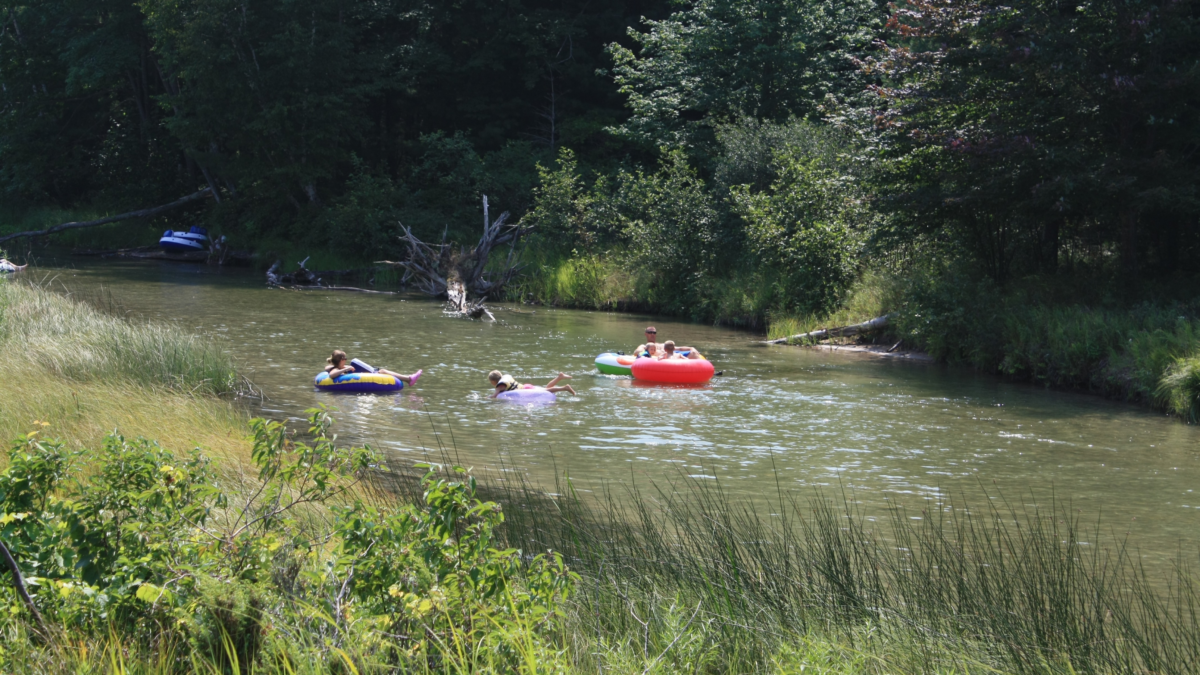 Grant River Tubing Near Cassville, Wisconsin | Dohrn Travels People floating down the Grant River on inner tubes near Cassville, Wisconsin, during a summer tubing trip.