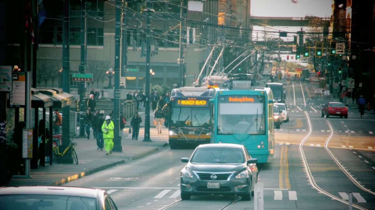 Seattle Metro bus traveling through downtown streets near the light rail and transit routes.