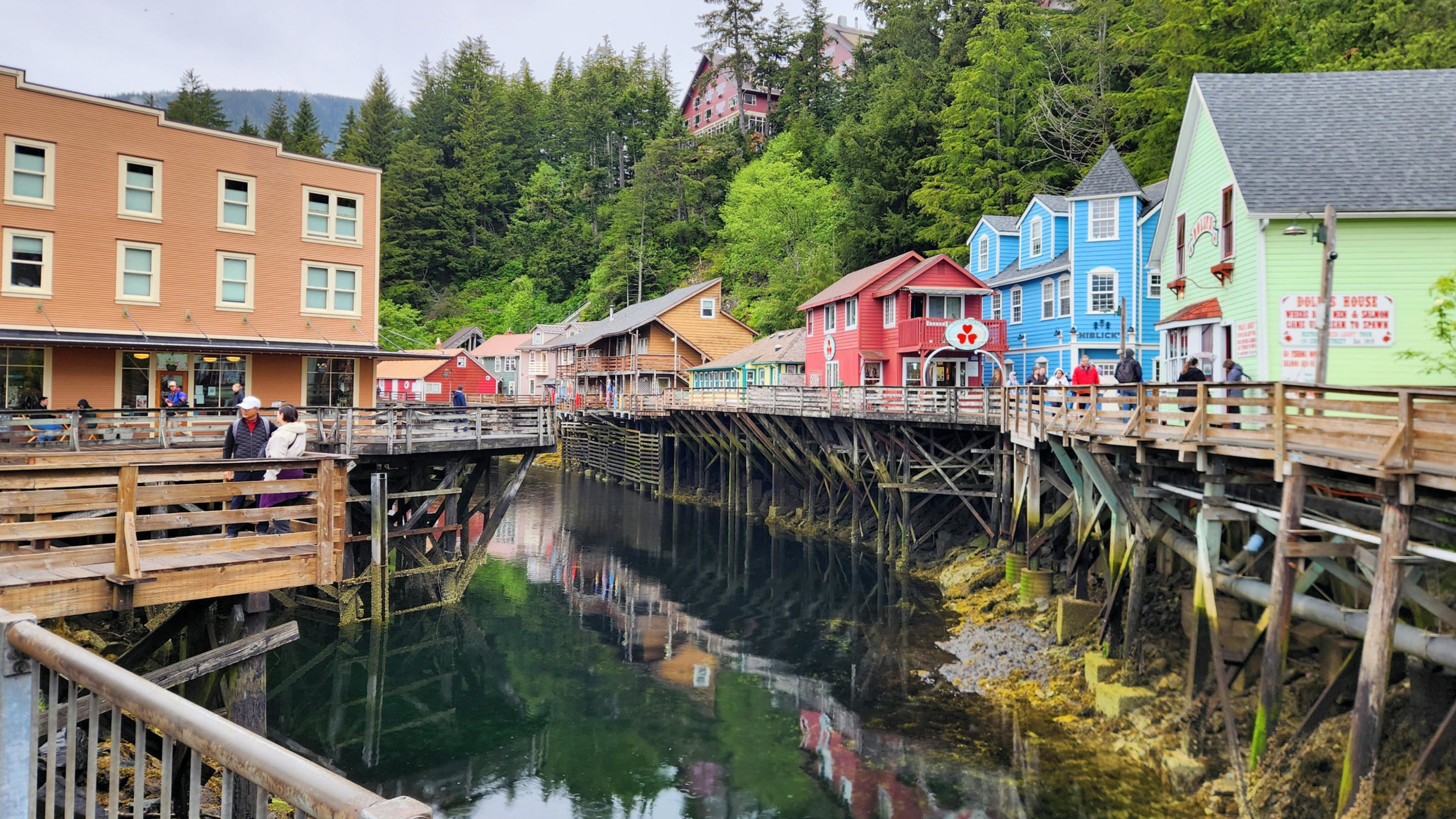 Creek Street boardwalk in Ketchikan, Alaska with colorful historic buildings built on pilings above Ketchikan Creek.
