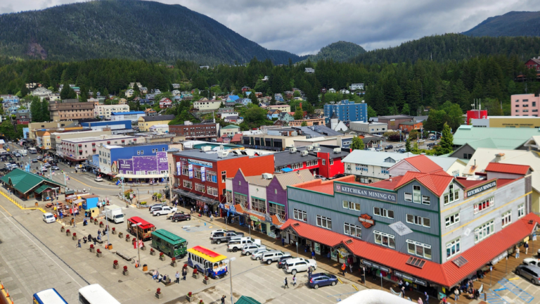 View of downtown Ketchikan, Alaska from a Holland America cruise ship overlooking colorful waterfront buildings and the cruise port.