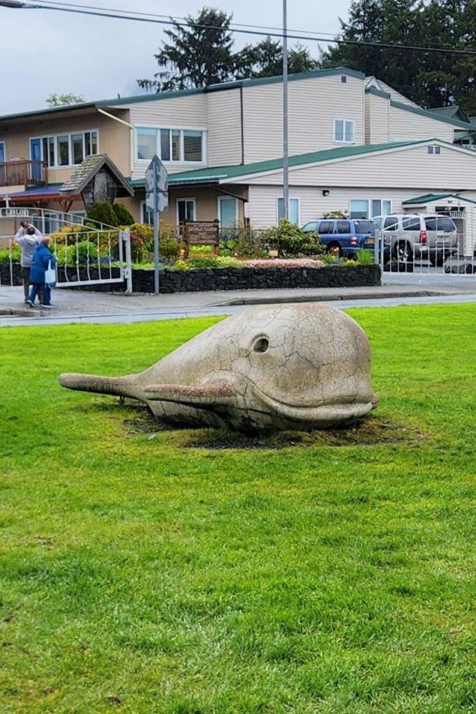 Whale sculpture on the grass at Crescent Harbor Park in Sitka, Alaska.