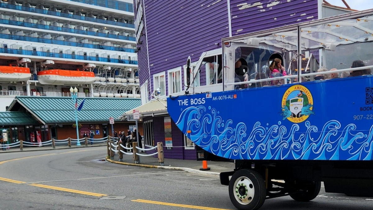 Ketchikan Duck Tour Shore Excursion | Dohrn Travels Ketchikan Duck Tour amphibious vehicle driving through downtown Ketchikan near the cruise port.
