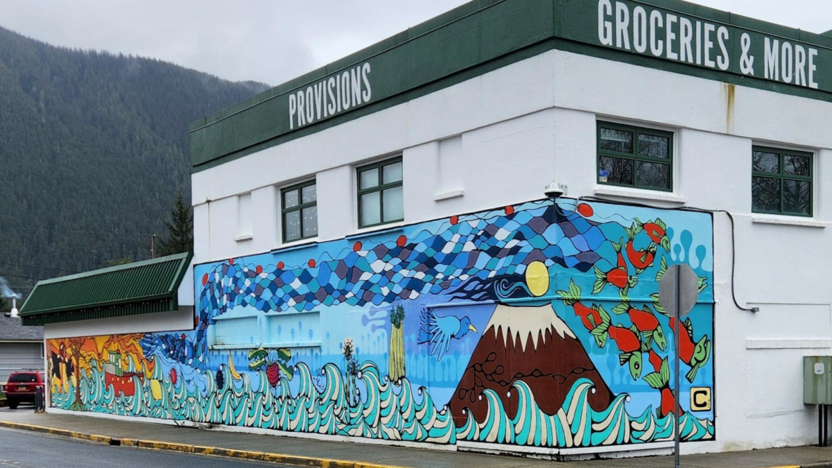 Colorful Alaska-themed mural on a market building in downtown Sitka, Alaska.
