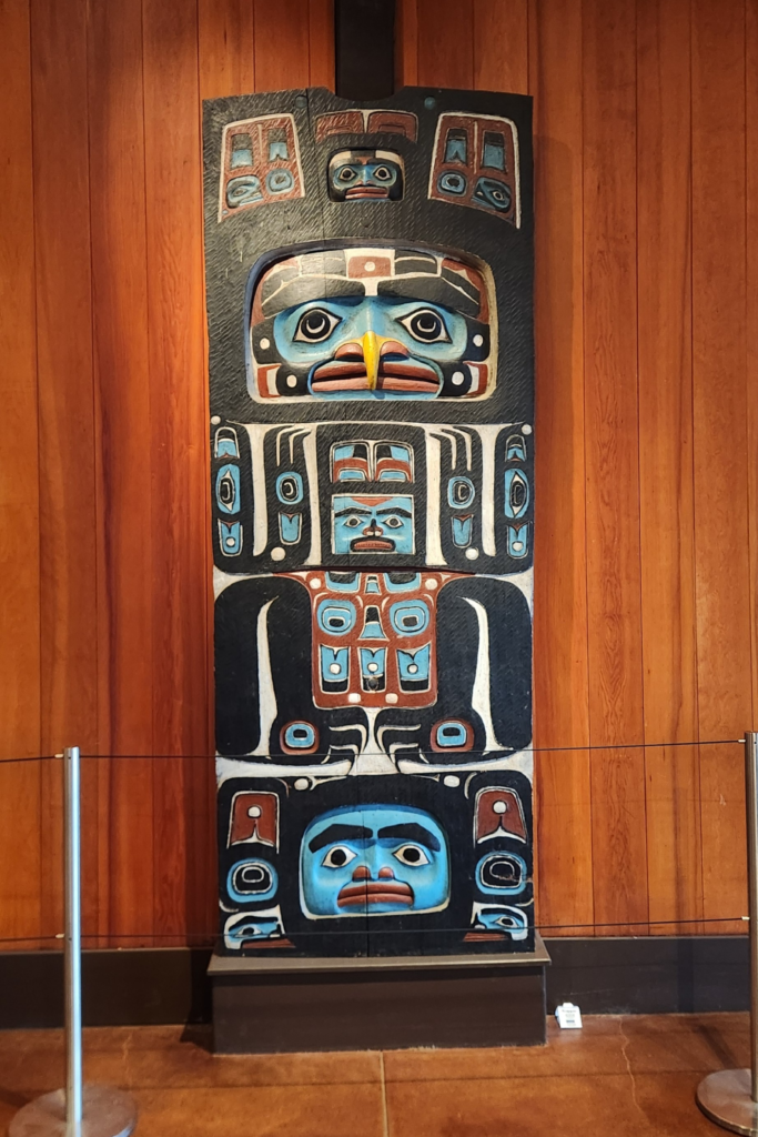 Carved Alaska Native totem pole exhibit at Sitka National Historical Park in Alaska