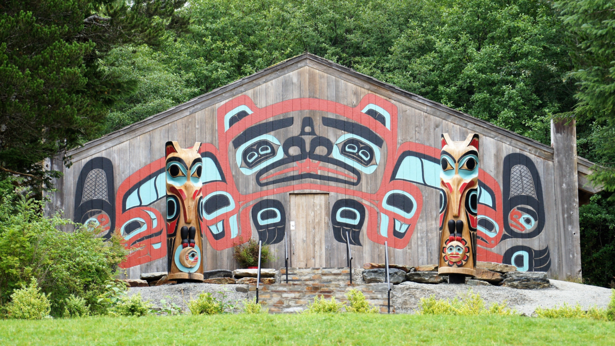 Native Alaskan Cultural Experience in Ketchikan | Dohrn Travels Traditional Native Alaskan clan house with colorful totem artwork in Ketchikan, Alaska.