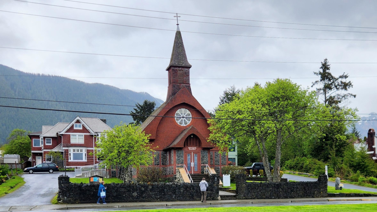 St. Peter’s by-the-Sea Episcopal Church surrounded by trees and mountains in Sitka Alaska
