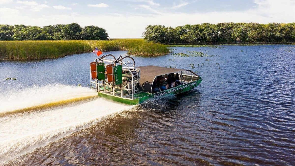 Everglades Holiday Park airboat speeding across the wetlands near Fort Lauderdale