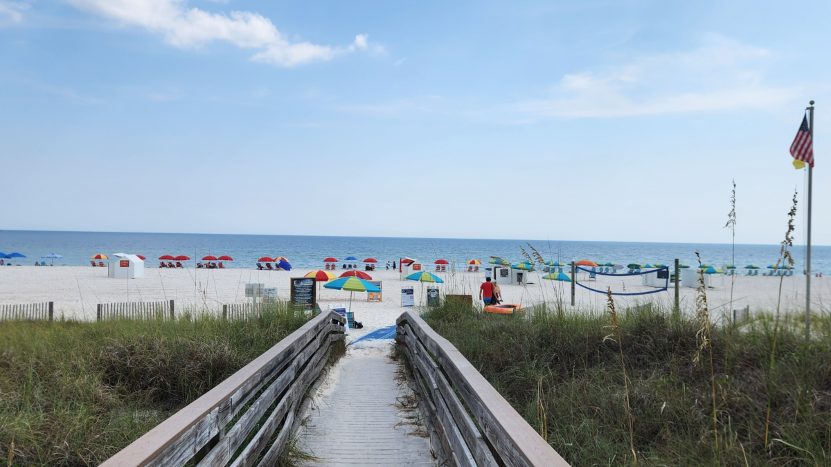 Boardwalk leading through the dunes to the beach in Orange Beach, Alabama
