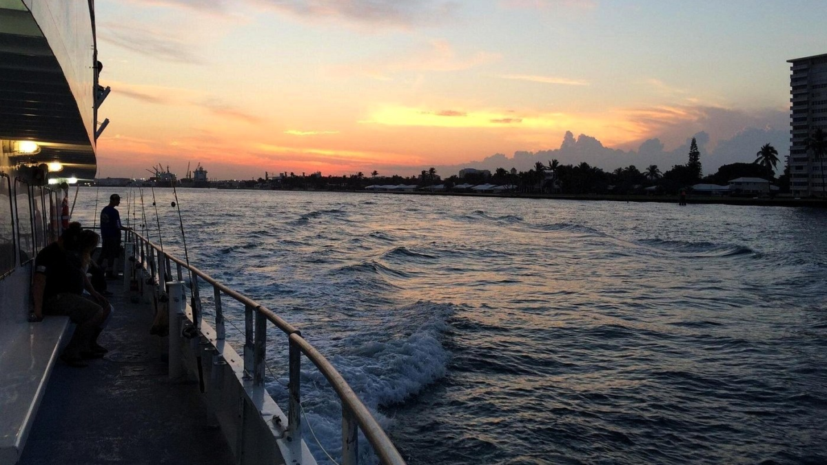Anglers aboard a drift fishing boat at sunset in Fort Lauderdale
