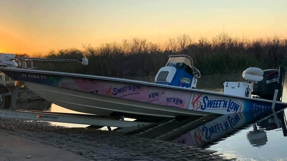 Small fishing boat at the Florida Everglades during sunset