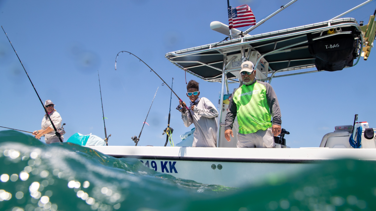 Anglers fishing from a boat on a sunny day in South Florida