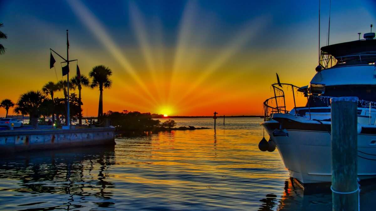 Fishing boats at a Florida marina during a colorful sunset