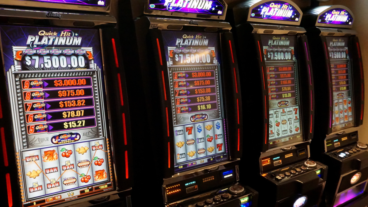 Row of slot machines inside a cruise ship casino