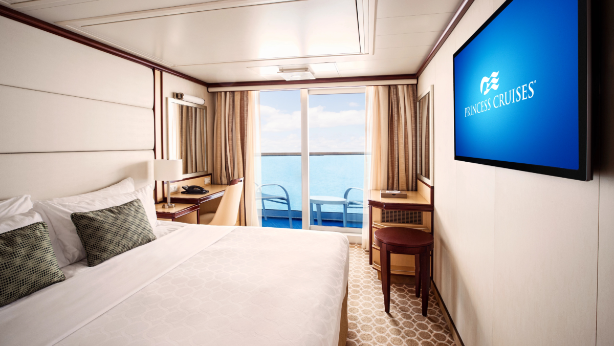 Royal Princess balcony cabin with bed and private ocean-view balcony
