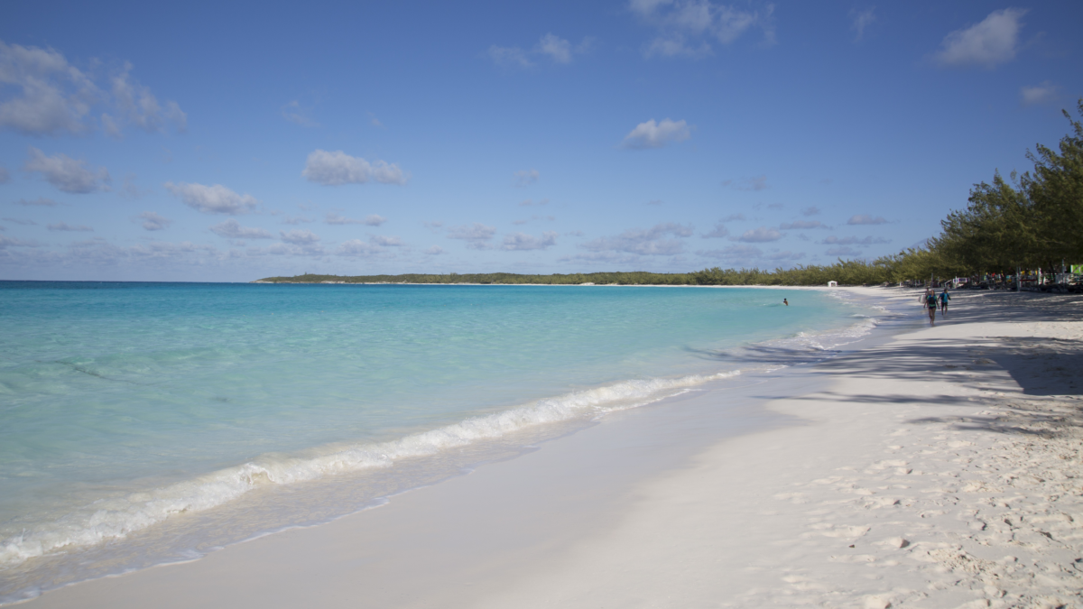 White sand beach and clear turquoise water at Half Moon Cay in the Bahamas.