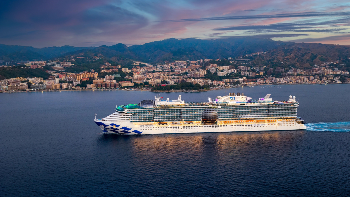 Star Princess sailing at sea near Messina, Italy at sunrise