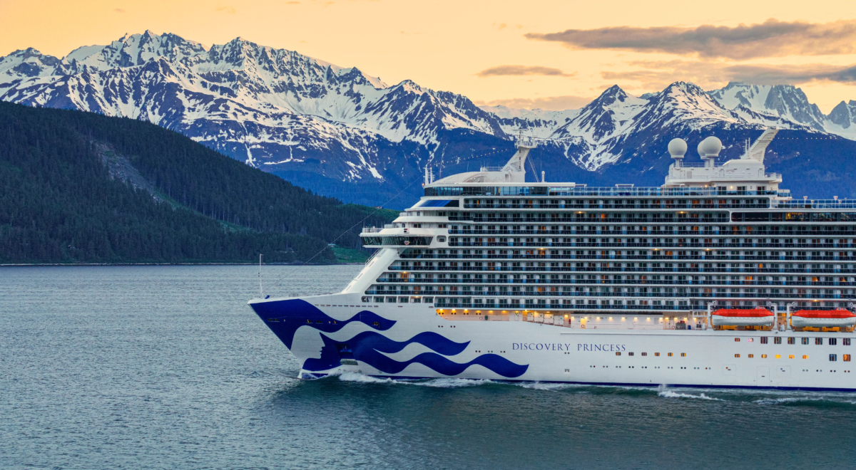 Discovery Princess sailing past mountains near Skagway Alaska